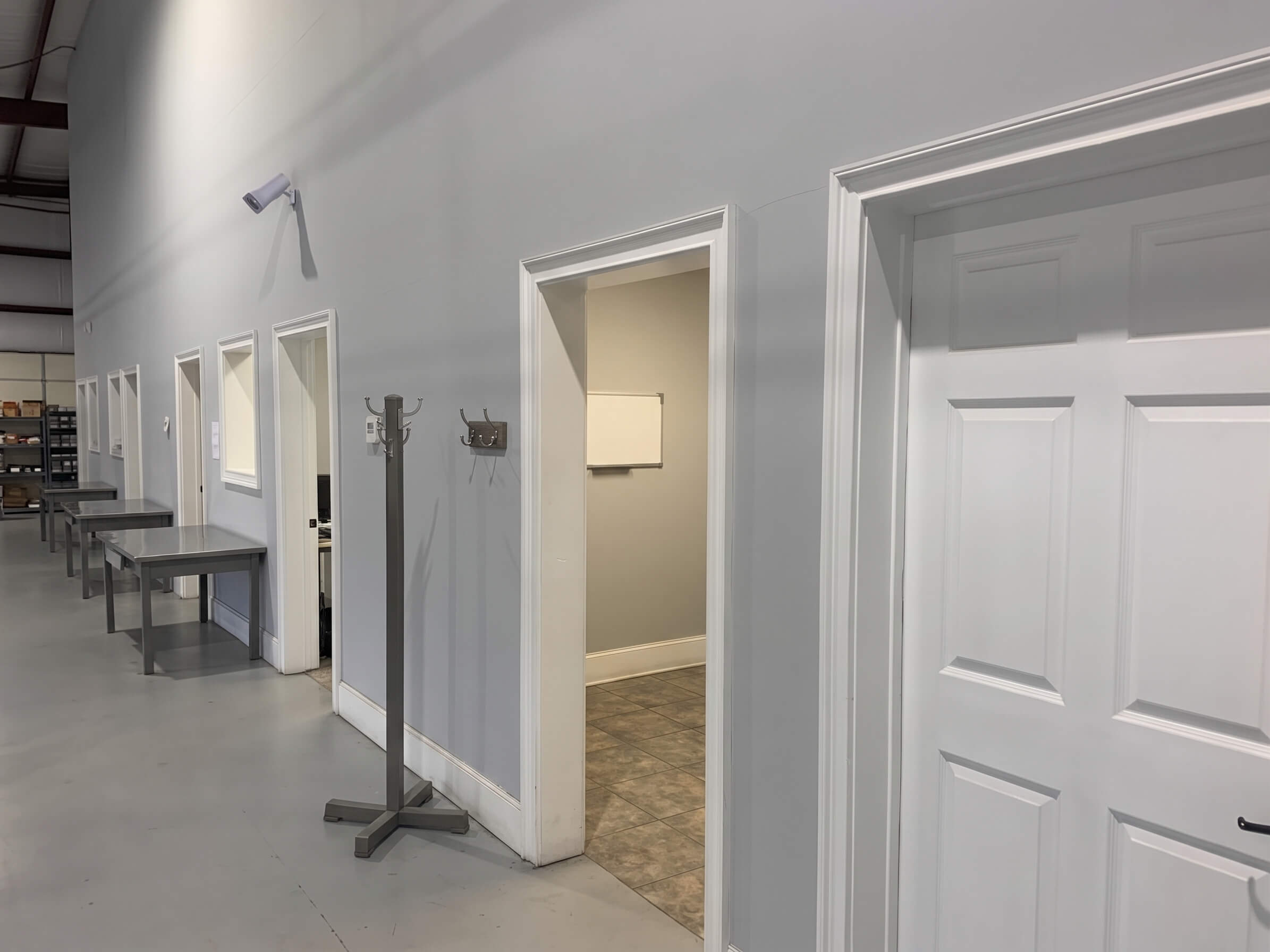 The office corridor at AME, with engineering offices opening onto the shop floor